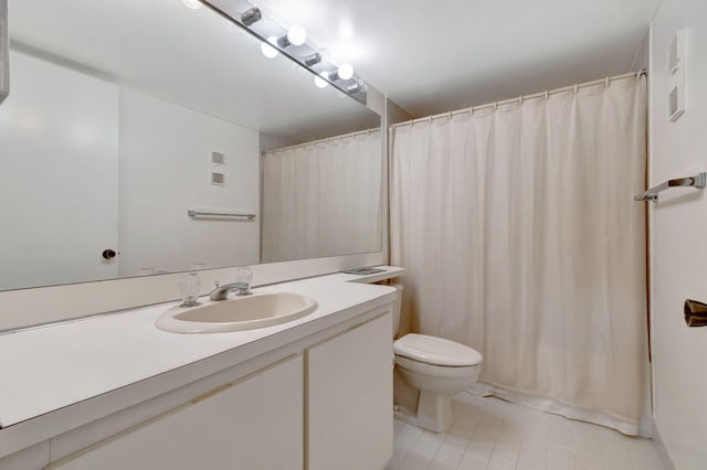 bathroom with tile patterned floors, walk in shower, vanity, and toilet