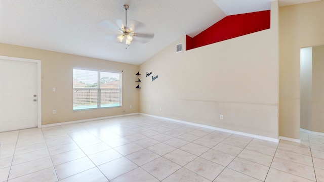 unfurnished room with ceiling fan, light tile patterned flooring, a textured ceiling, and high vaulted ceiling