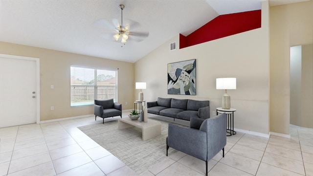 living room with ceiling fan, light tile patterned floors, a textured ceiling, and high vaulted ceiling