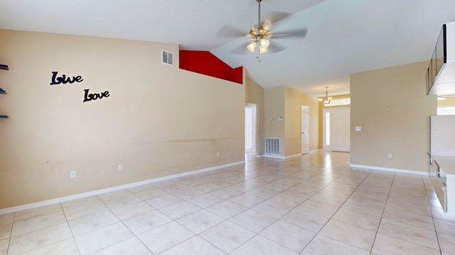 tiled empty room featuring ceiling fan with notable chandelier and high vaulted ceiling