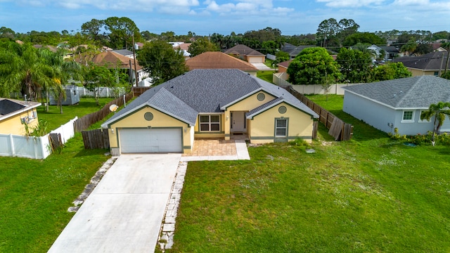 ranch-style home with a front yard and a garage