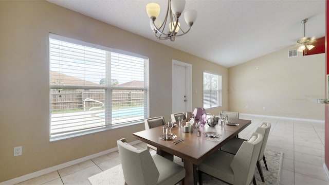 dining space featuring light tile patterned floors, ceiling fan, and lofted ceiling