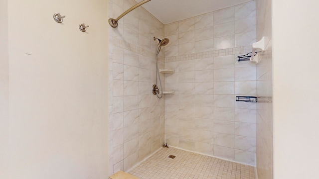 bathroom with tiled shower