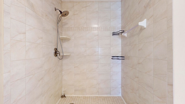 bathroom with a tile shower