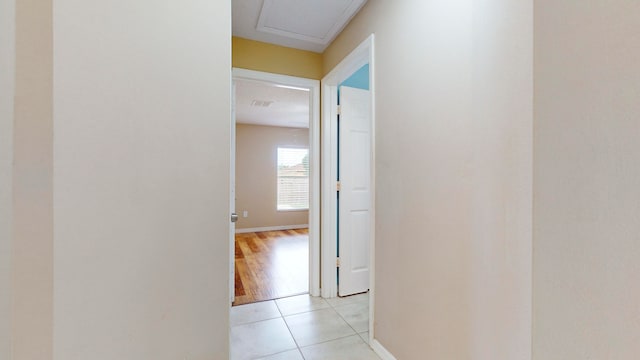 corridor with light tile patterned floors