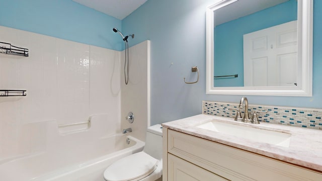 full bathroom with decorative backsplash, shower / washtub combination, vanity, and toilet