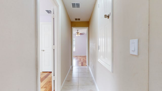 hall with light hardwood / wood-style floors