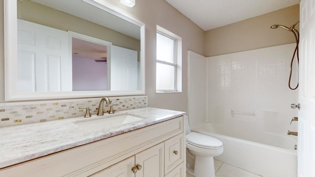 full bathroom featuring vanity, backsplash, tile patterned flooring, toilet, and tub / shower combination