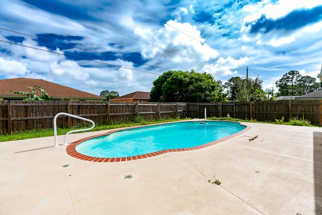 view of swimming pool featuring a patio area