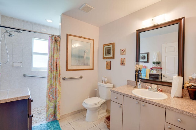 bathroom with tile patterned floors, vanity, curtained shower, and toilet