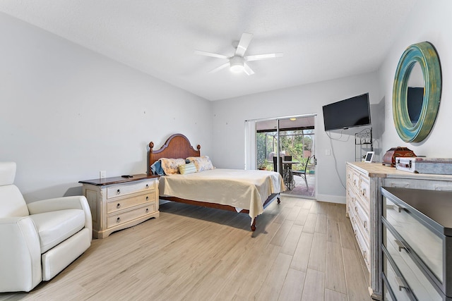 bedroom featuring light hardwood / wood-style flooring, ceiling fan, and access to exterior