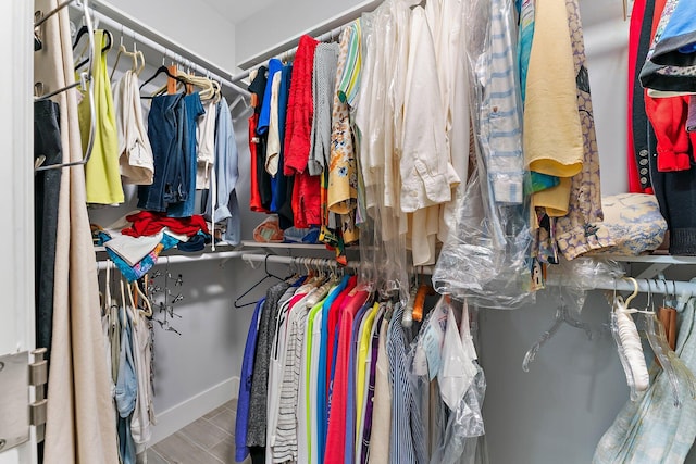 walk in closet featuring wood-type flooring