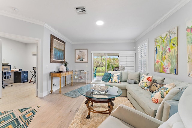 living room with ornamental molding and light wood-type flooring