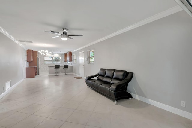 interior space featuring ceiling fan with notable chandelier and crown molding