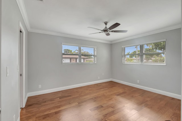 spare room with ceiling fan, hardwood / wood-style flooring, and plenty of natural light