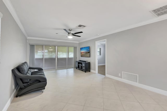 living area with ceiling fan, crown molding, and light tile patterned floors