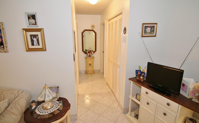 corridor with light tile patterned floors