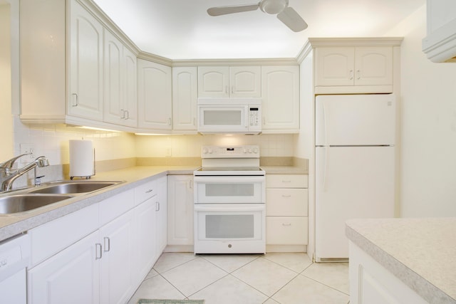 kitchen featuring ceiling fan, light tile patterned flooring, sink, white appliances, and tasteful backsplash