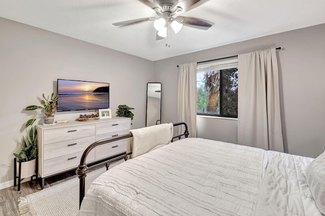 bedroom featuring ceiling fan and wood-type flooring