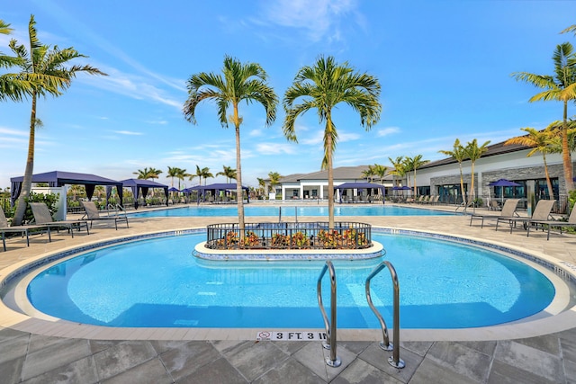 view of swimming pool with a patio area