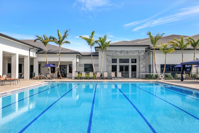 view of swimming pool featuring a patio area