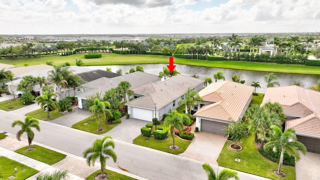 birds eye view of property featuring a water view