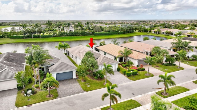 birds eye view of property with a water view