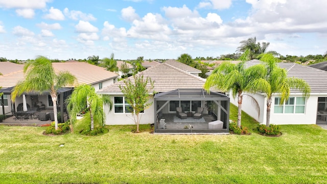 10571 SW Sunray St, Port Saint Lucie, FL 34987 - rear view of property with a tile roof, a patio area, a yard, and glass enclosure