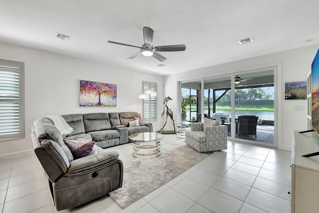 10571 SW Sunray St, Port Saint Lucie, FL 34987 - tiled living area featuring a ceiling fan and baseboards