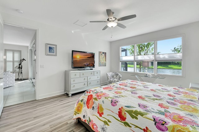 bedroom featuring light hardwood / wood-style floors and ceiling fan