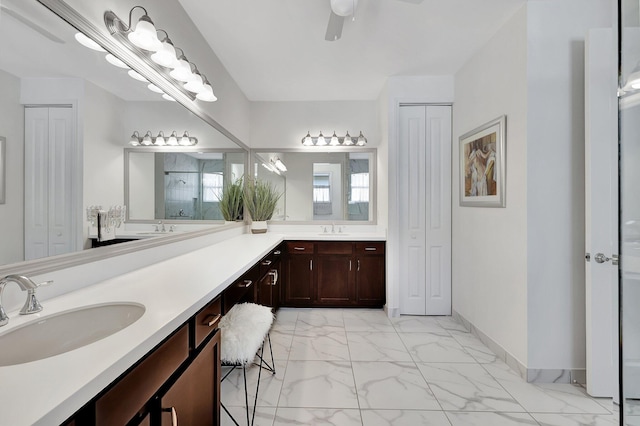 bathroom featuring vanity, ceiling fan, and a shower with shower door