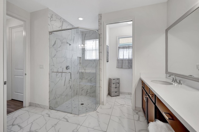 10571 SW Sunray St, Port Saint Lucie, FL 34987 - bathroom with marble look tiles, baseboards, vanity, a marble finish shower, and recessed lighting