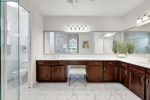 bathroom featuring vanity, toilet, walk in shower, and ceiling fan