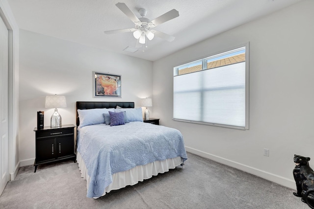 carpeted bedroom featuring ceiling fan