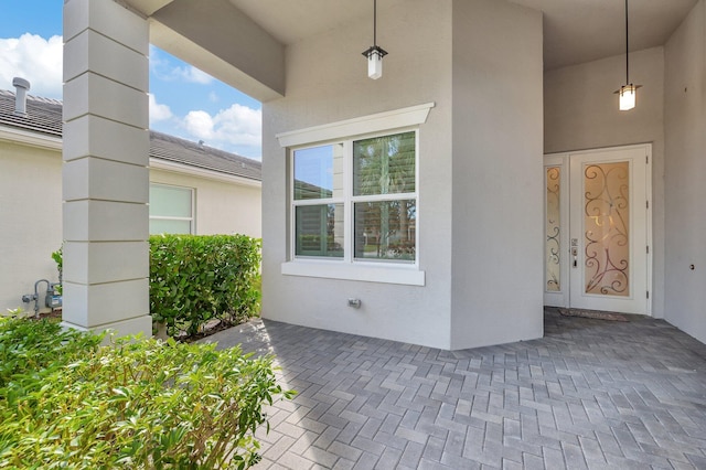 10571 SW Sunray St, Port Saint Lucie, FL 34987 - doorway to property featuring stucco siding