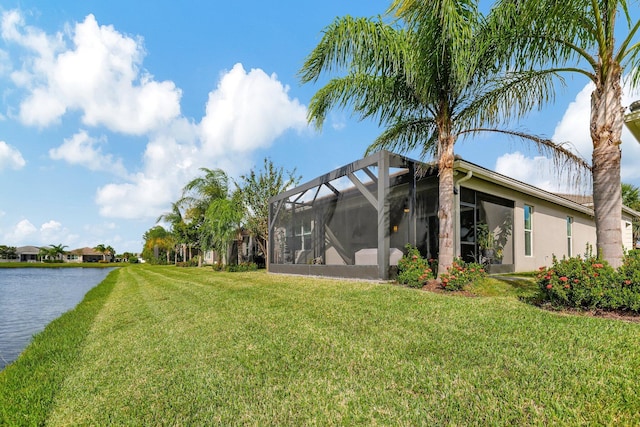 view of yard featuring a water view and a lanai