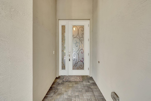 10571 SW Sunray St, Port Saint Lucie, FL 34987 - view of exterior entry featuring stucco siding