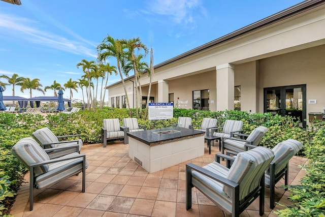 view of patio with a fire pit