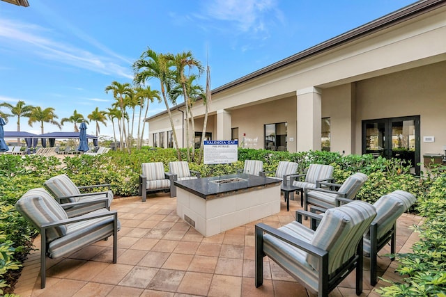 10571 SW Sunray St, Port Saint Lucie, FL 34987 - view of patio featuring a fire pit
