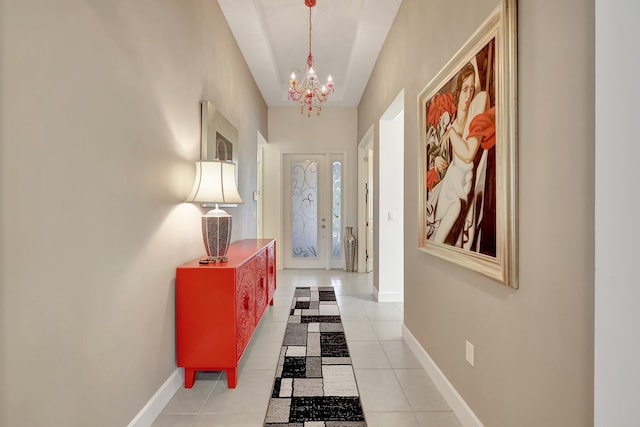 interior space featuring a notable chandelier and light tile patterned flooring