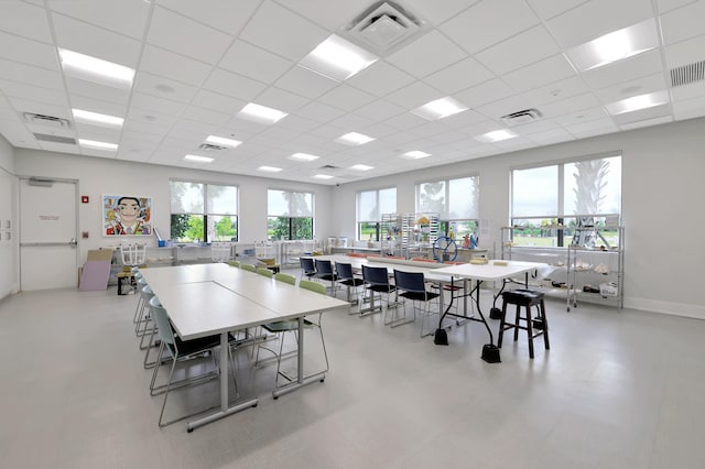 dining area featuring a paneled ceiling