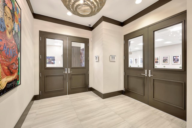 10571 SW Sunray St, Port Saint Lucie, FL 34987 - foyer featuring french doors, tile patterned flooring, baseboards, a chandelier, and recessed lighting