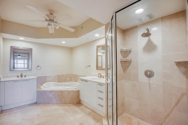 bathroom with two vanities, a sink, a tile shower, and a bath