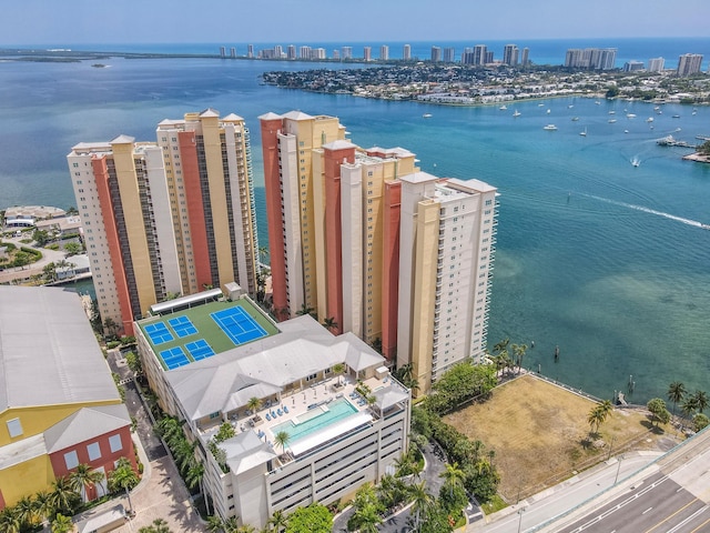 drone / aerial view featuring a view of city and a water view