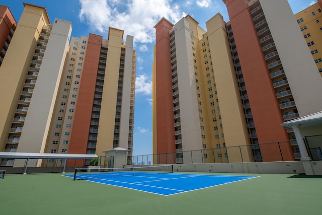 view of sport court with fence