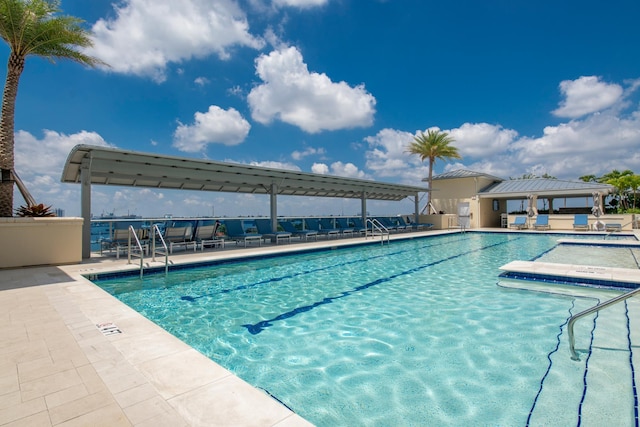 community pool featuring a gazebo and a patio