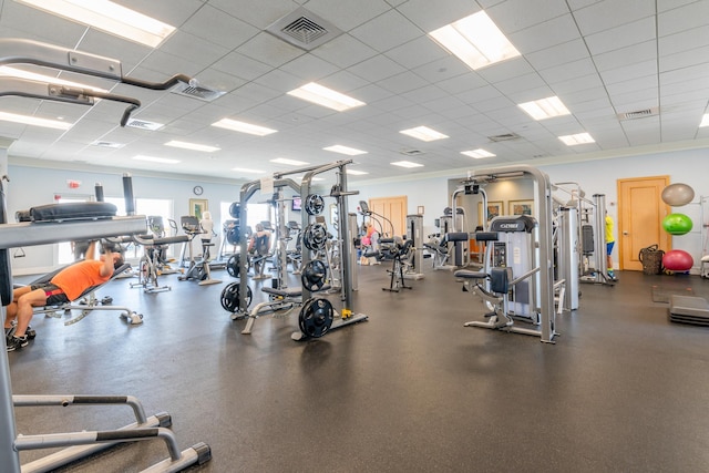 workout area featuring visible vents and a drop ceiling