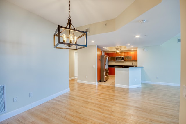 interior space featuring visible vents, baseboards, light wood-style flooring, an inviting chandelier, and recessed lighting