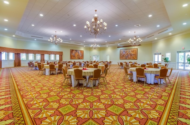 dining room featuring a high ceiling, a tray ceiling, and crown molding