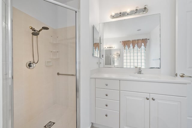 bathroom with vanity and an enclosed shower